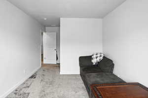 Bedroom with carpet flooring and a textured ceiling