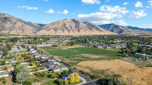 View of mountain background featuring nearby suburban area