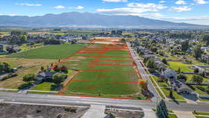 Aerial view of property's location with mountains and property parcel outlined