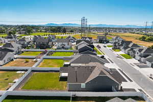 Aerial perspective of suburban area featuring a mountain backdrop
