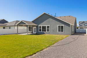 Rear view of house with a patio and stucco siding