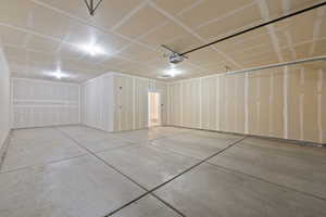 Garage featuring a garage door opener