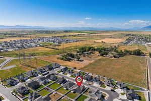 Aerial view of property's location with a mountainous background