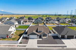 Aerial view of residential area featuring a mountainous background