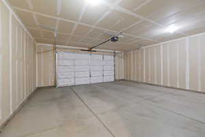 Garage featuring a garage door opener