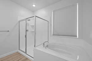 Primary bathroom with spacious shower, and soaker tub