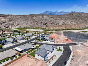 Aerial view of residential area featuring a mountainous background
