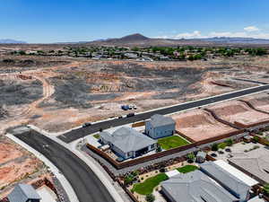 Aerial view of a mountainous background and a desert landscape