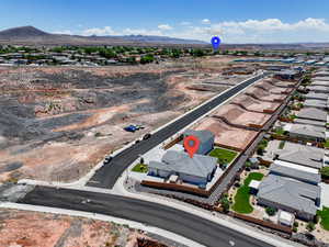 Aerial perspective of suburban area with a mountainous background