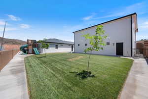 View of yard featuring a playground
