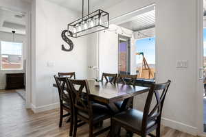 Dining area featuring plenty of natural light and wood finished floors