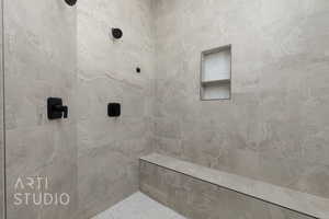 Bathroom featuring tiled shower