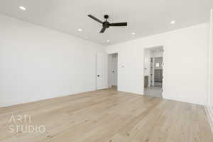 Empty room with ceiling fan, recessed lighting, and light wood-style floors