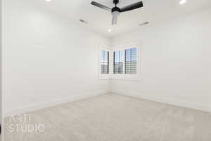 Carpeted empty room featuring recessed lighting and a ceiling fan