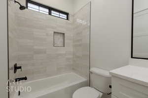 Bathroom with vanity and tub / shower combination