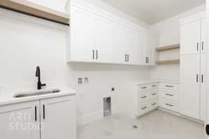 Laundry area featuring cabinet space, washer hookup, electric dryer hookup, and gas dryer hookup