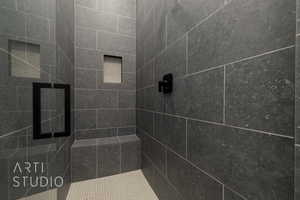 Full bathroom with tiled shower