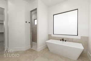 Full bath featuring a freestanding bath