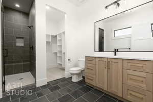 Full bathroom featuring a stall shower and vanity