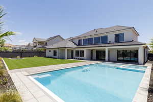 View of swimming pool with a pool with connected hot tub and a patio