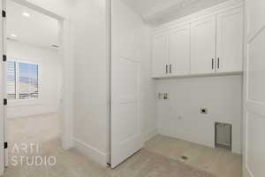 Laundry room with cabinet space, hookup for an electric dryer, washer hookup, gas dryer hookup, and recessed lighting