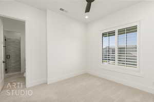 Unfurnished room with a ceiling fan, light carpet, and recessed lighting