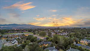 Aerial view at dusk of a mountain view and a residential view