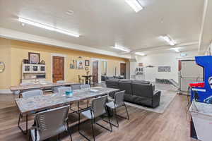 Dining area with wood finished floors and baseboards