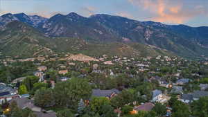 View of mountain backdrop featuring nearby suburban area