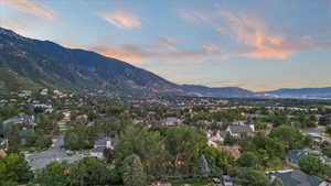 View of mountain background featuring nearby suburban area