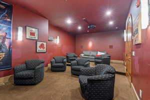Carpeted cinema featuring recessed lighting and baseboards