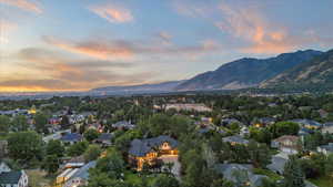 Aerial view of property's location with mountains and nearby suburban area