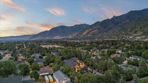 Aerial view of property's location with a mountainous background