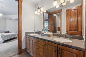 Full bath featuring ensuite bathroom and double vanity