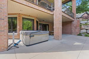 Patio / terrace featuring a hot tub and a patio