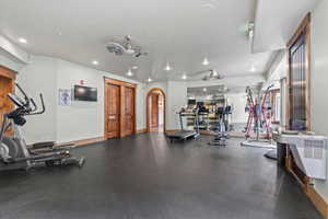Workout area with recessed lighting and baseboards