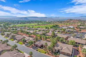 Aerial perspective of suburban area with a mountain backdrop