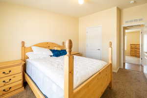 Bedroom with carpet floors and baseboards