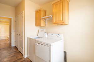 Laundry room with separate washer and dryer and cabinet space