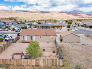 Aerial perspective of suburban area with a mountainous background