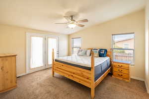 Bedroom with carpet flooring, access to exterior, and ceiling fan