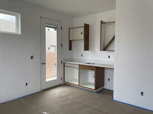 Kitchen featuring concrete flooring