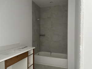Full bath featuring vanity and bathing tub / shower combination