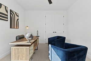 Carpeted office with baseboards