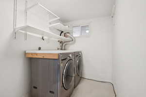 Laundry room featuring washing machine and dryer