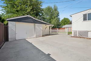 Detached garage with concrete driveway