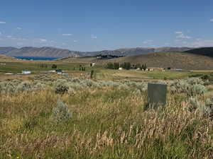 View of mountain background featuring rural landscape
