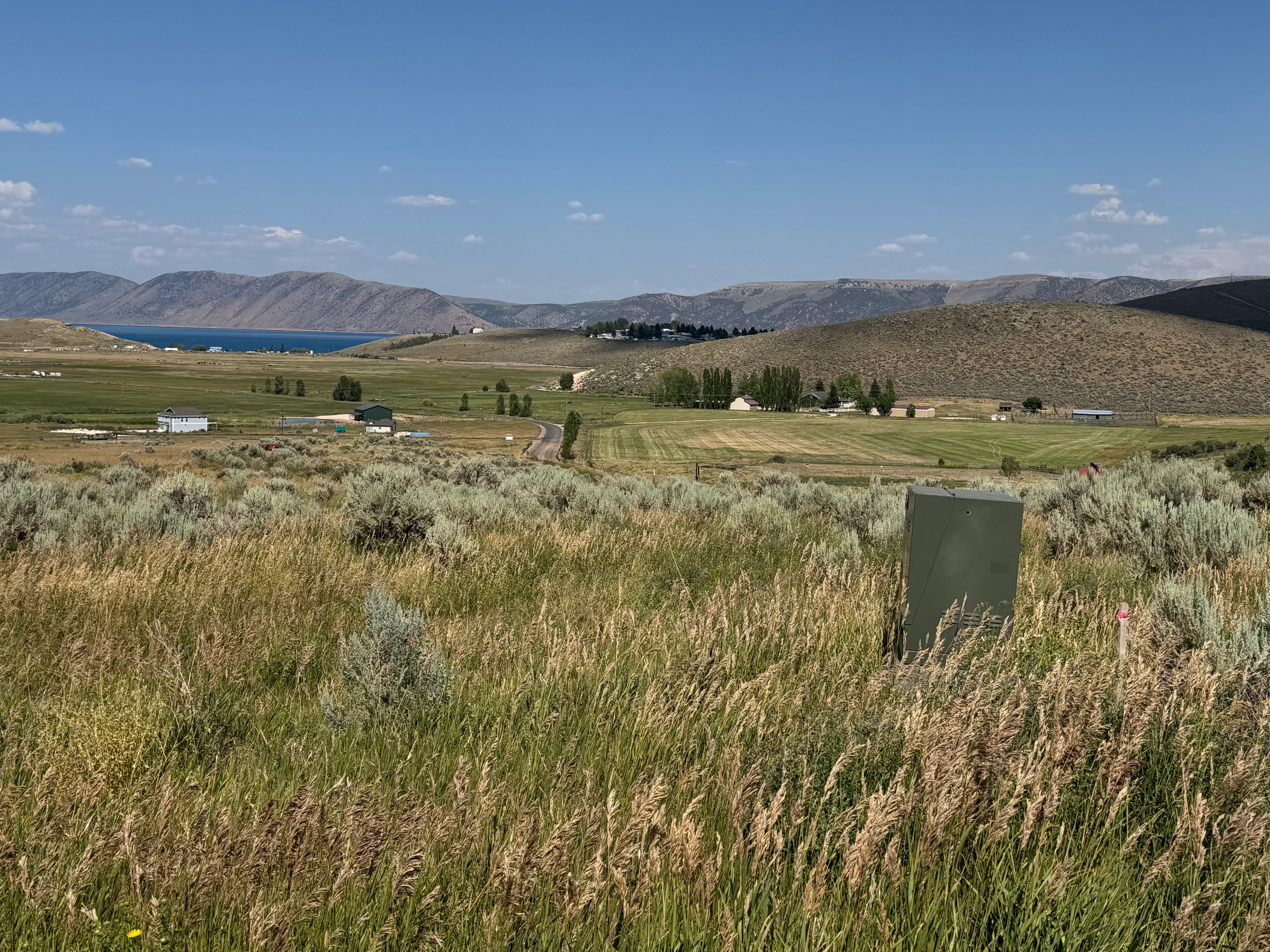View of mountain background featuring rural landscape