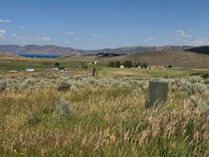 View of mountain background featuring rural landscape