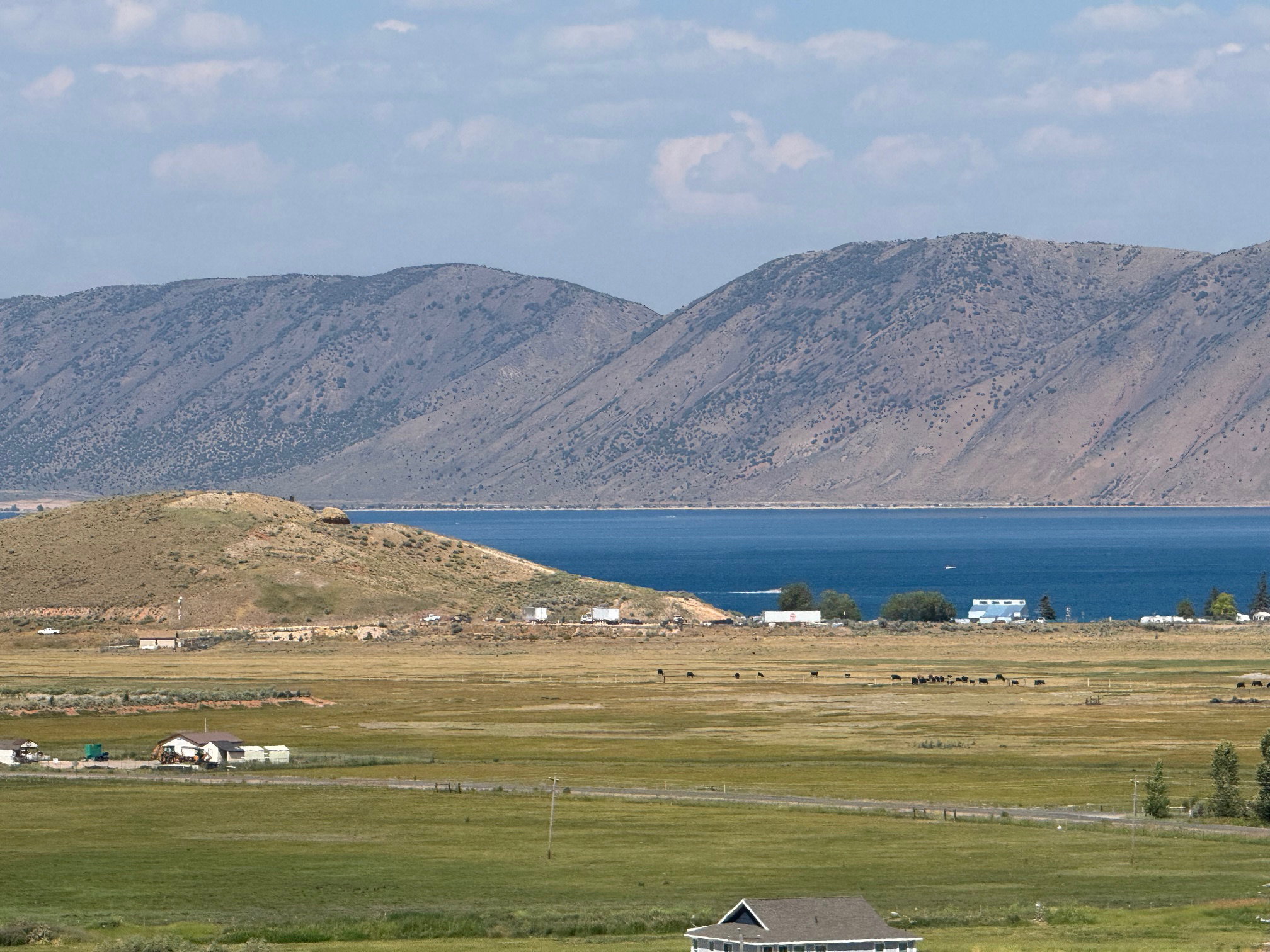 View of mountain backdrop featuring a large body of water